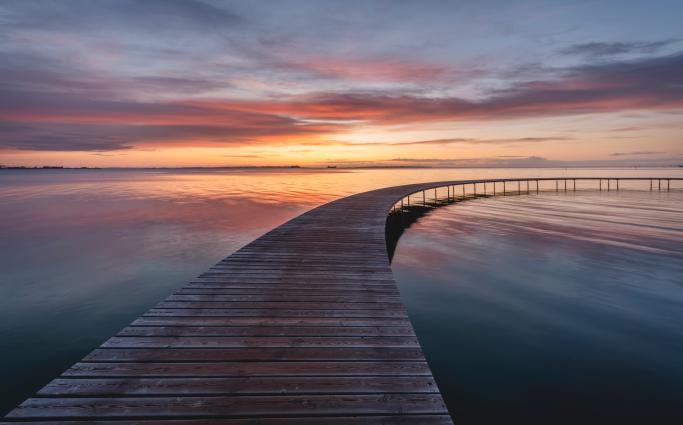 Bridge into the skyline over water