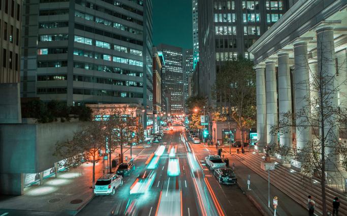Speeding cars on a city street
